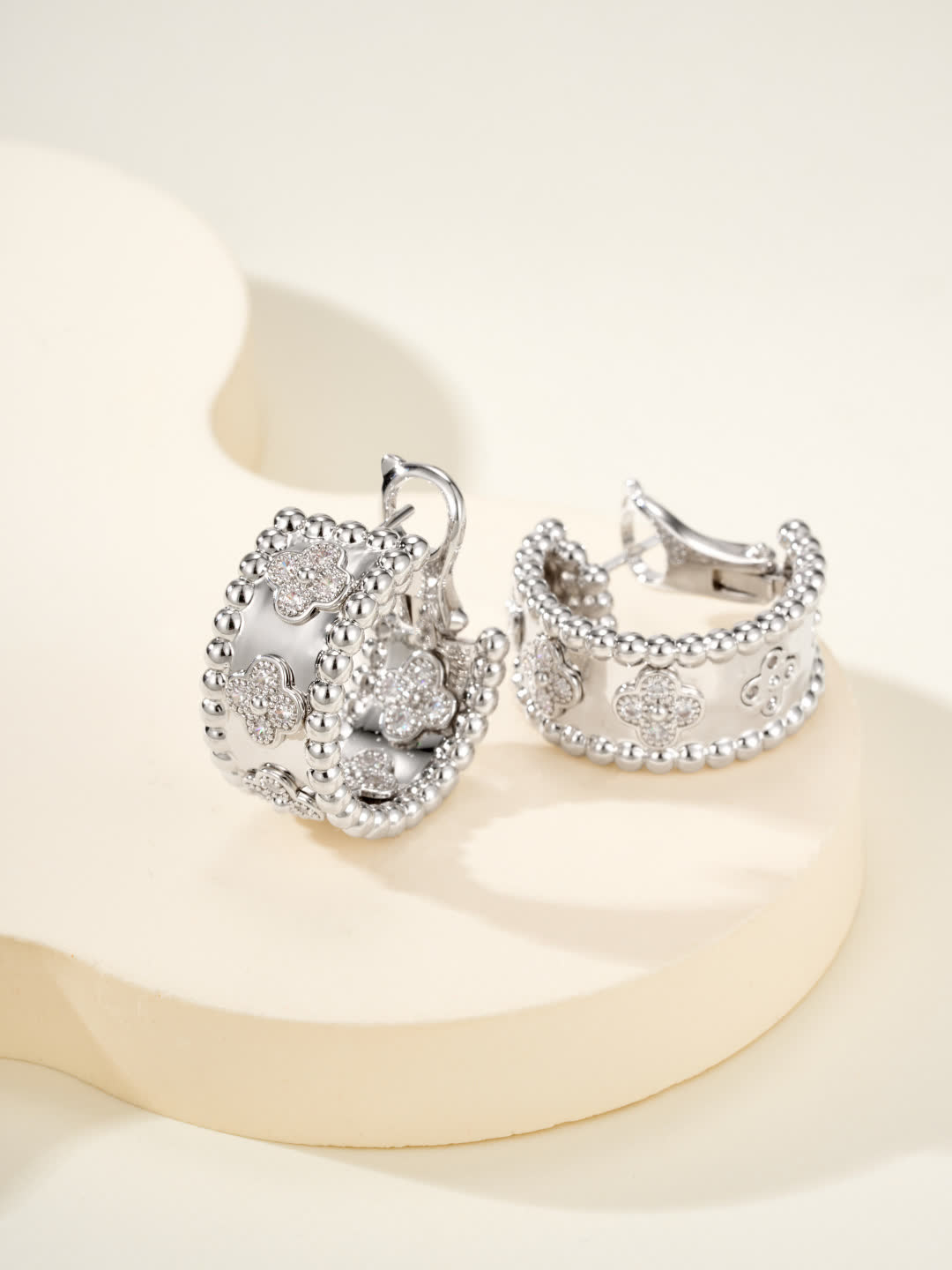 Van Cleef & Arpels Elegant Gold and Silver Hoop Earrings with Diamond Accents